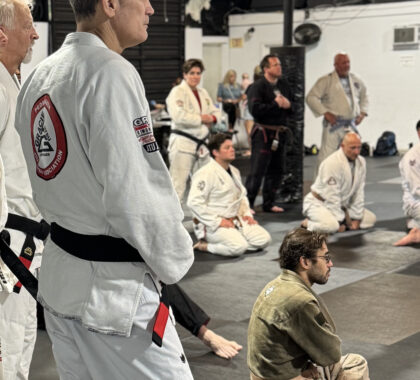 Coach Aaron Pedro Sauer Association BJJ Seminar, Georgia 2026. - Pedro Sauer Academy - Pedro Sauer Academy BJJ black belt Coach Aaron on the mat during a Pedro Sauer seminar in Georgia.