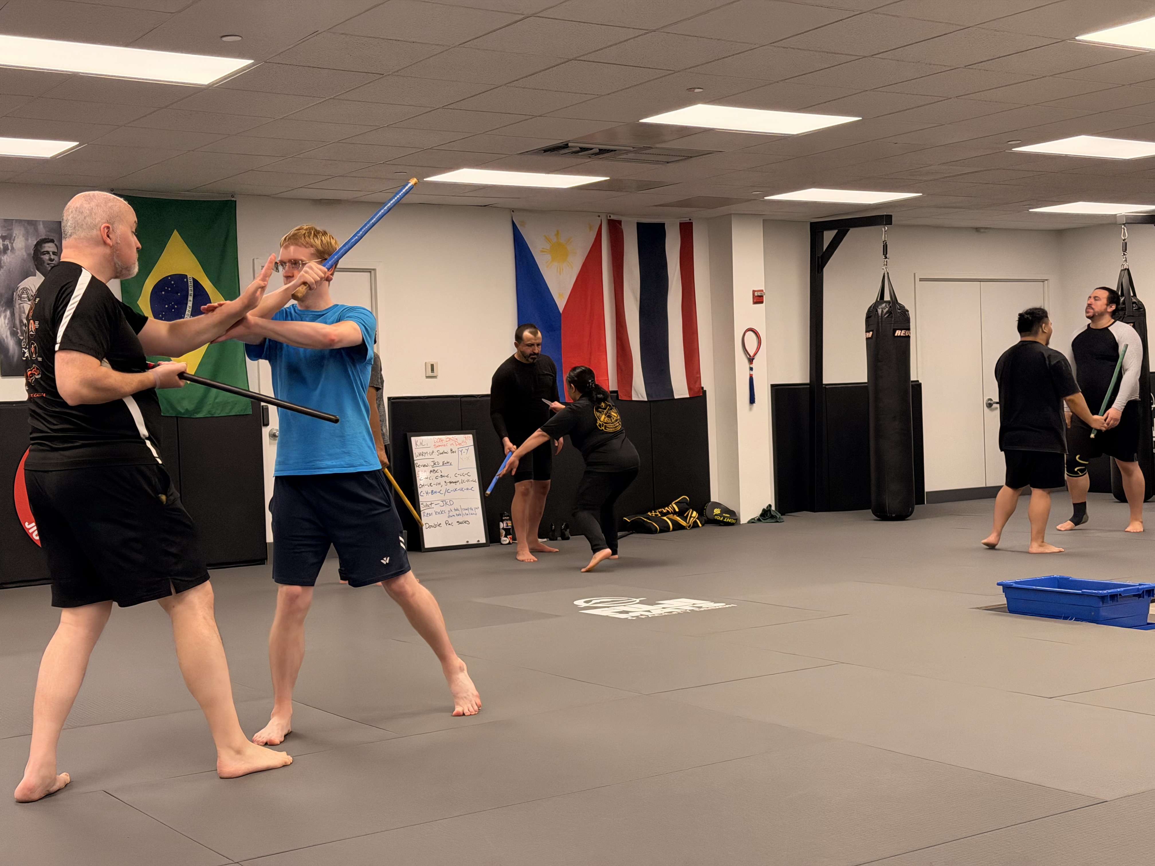 Students practice Kali stick drills during class at Pedro Sauer Academy in Herndon, Virginia