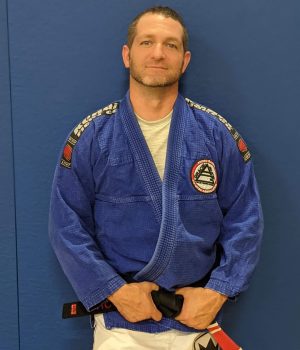 Professor Dan Chamberlain wearing a gi with a black belt.